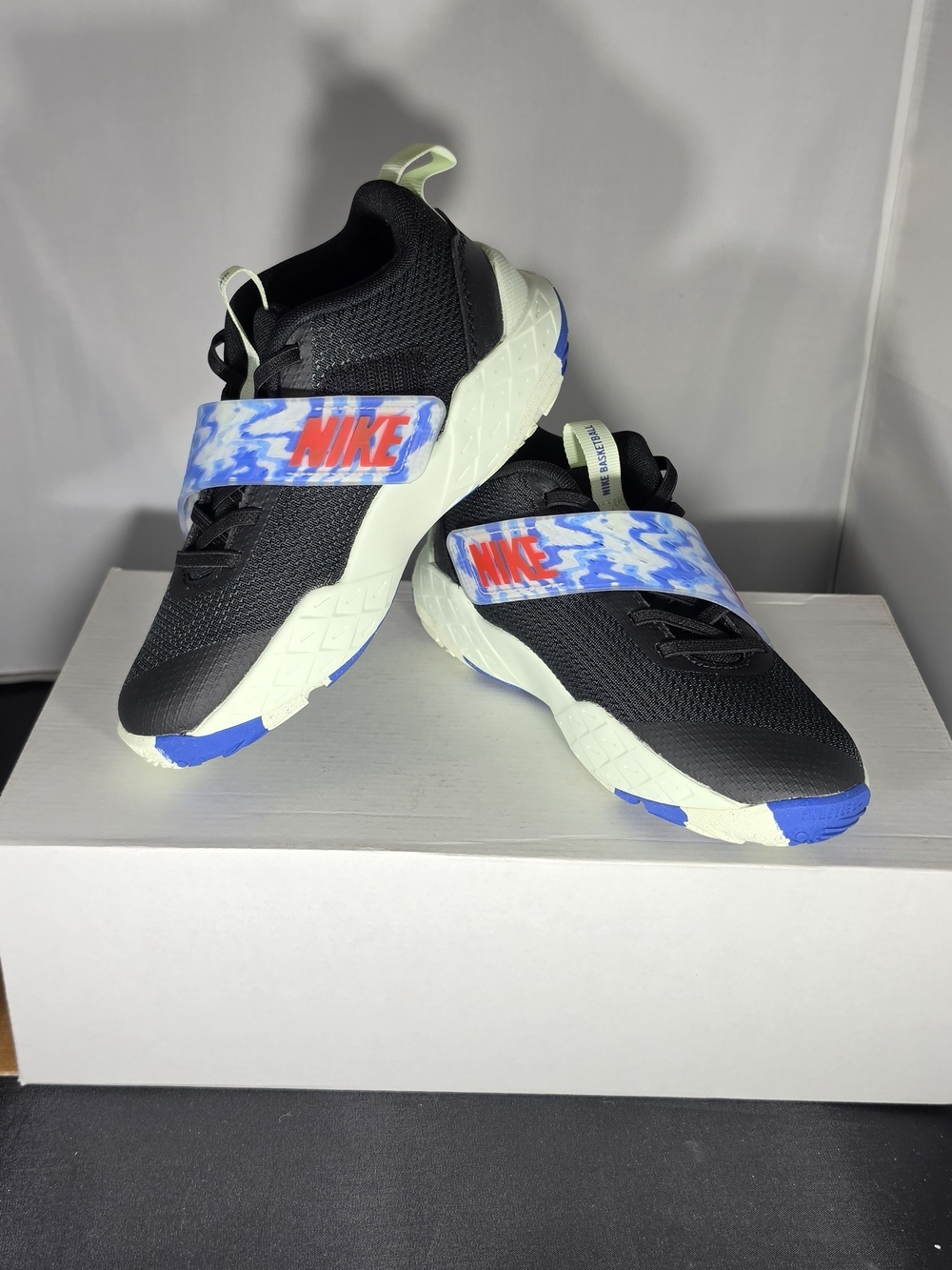 Nike Kids Black Sneakers with Blue and Cream Accents
